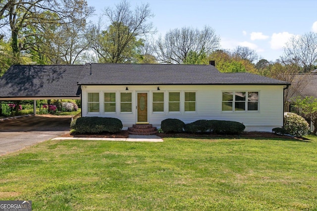 313 Ellenwood Dr, Bowdon, GA 30108 - single story home featuring a carport, concrete driveway, a front yard, and a shingled roof