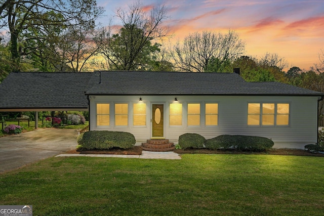 313 Ellenwood Dr, Bowdon, GA 30108 - view of front of property with a lawn, driveway, a shingled roof, an attached carport, and entry steps