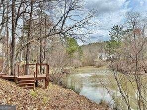 89 Paces Lakes Pt, Dallas, GA 30157 - water view featuring a heavily wooded area