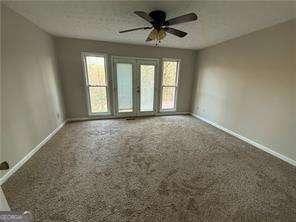 89 Paces Lakes Pt, Dallas, GA 30157 - spare room featuring healthy amount of natural light and ceiling fan