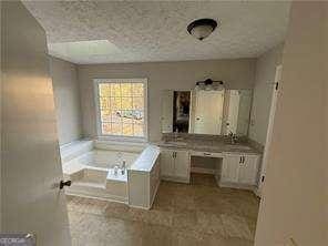 bathroom featuring a bath