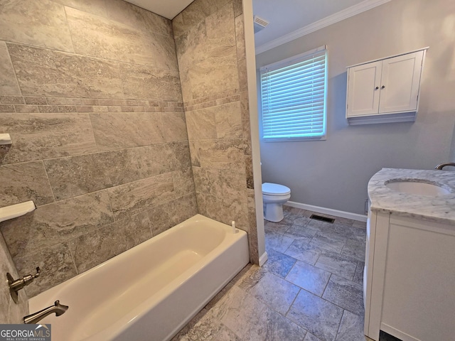 bathroom featuring crown molding, vanity, visible vents, toilet, and baseboards
