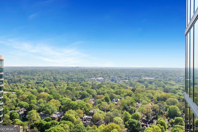 drone / aerial view with a view of trees