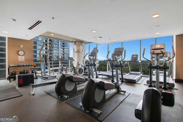 gym featuring visible vents, expansive windows, and recessed lighting