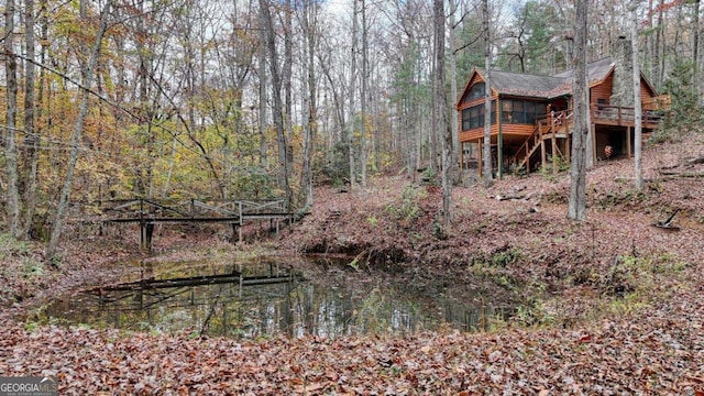 2479 Plum Orchard Rd Unit 1 & 2, Clayton, GA 30525 - view of yard featuring a sunroom, a deck, and a wooded view