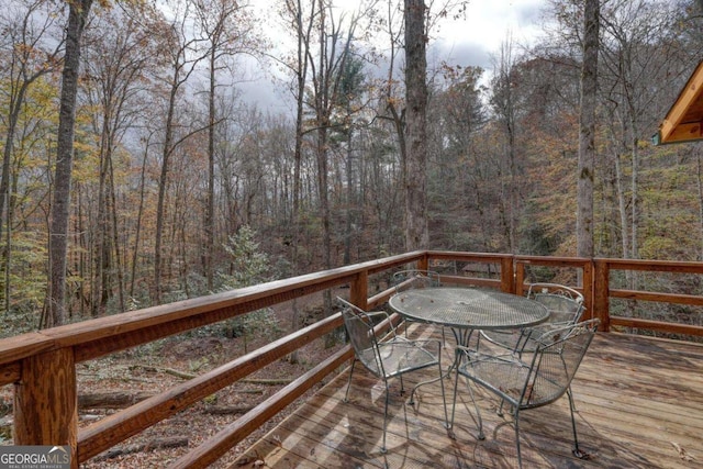 2479 Plum Orchard Rd Unit 1 & 2, Clayton, GA 30525 - deck with outdoor dining space and a view of trees