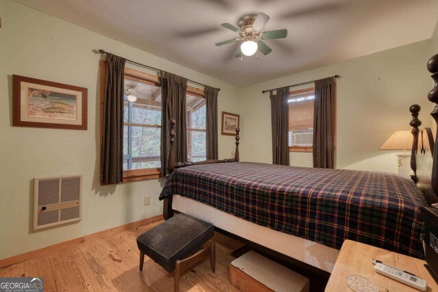 2479 Plum Orchard Rd Unit 1 & 2, Clayton, GA 30525 - bedroom featuring heating unit, wood finished floors, cooling unit, and ceiling fan