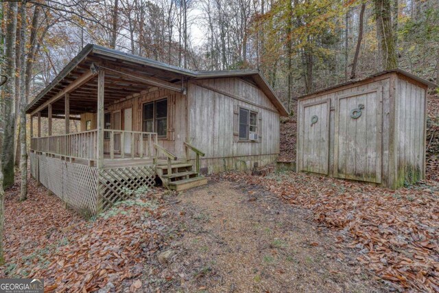 2479 Plum Orchard Rd Unit 1 & 2, Clayton, GA 30525 - view of front of home featuring a storage shed and a deck