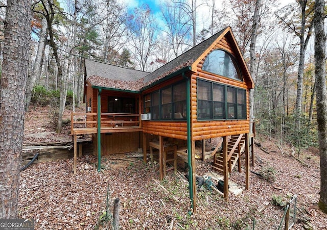 2479 Plum Orchard Rd Unit 1 & 2, Clayton, GA 30525 - view of side of property featuring a sunroom, stairway, roof with shingles, a deck, and log veneer siding