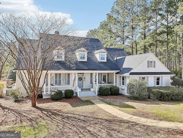 111 Okoni Ln, Eatonton, GA 31024 - new england style home featuring a porch