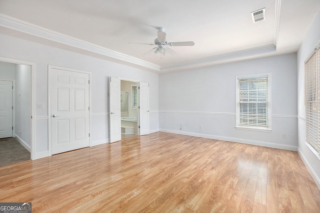 4505 Lakefield Bnd, Berkeley Lake, GA 30096 - unfurnished bedroom featuring light wood-style flooring, a raised ceiling, crown molding, ensuite bath, and a ceiling fan