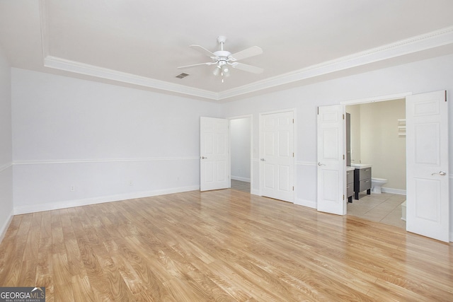 4505 Lakefield Bnd, Berkeley Lake, GA 30096 - unfurnished bedroom with a raised ceiling, light wood-type flooring, ornamental molding, ensuite bath, and ceiling fan