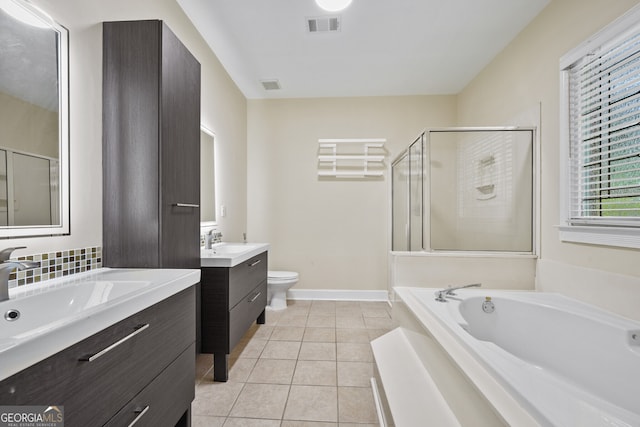 full bath with a stall shower, two vanities, tile patterned flooring, a bath, and baseboards