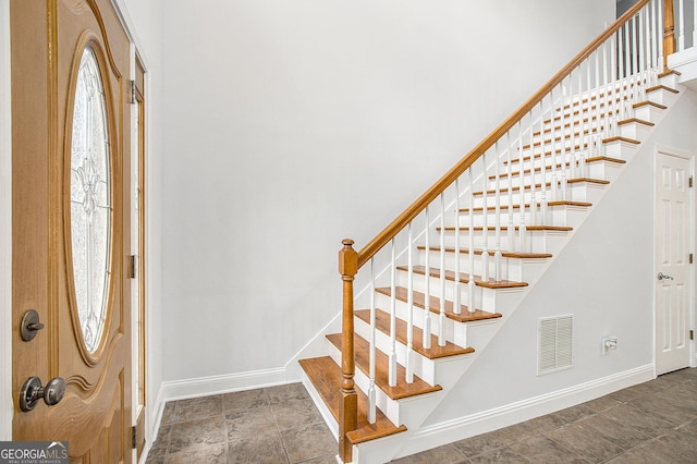 4505 Lakefield Bnd, Berkeley Lake, GA 30096 - entrance foyer with stairway and stone finish flooring
