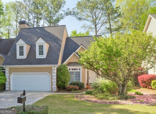 view of front of house featuring concrete driveway, a chimney, and a shingled roof