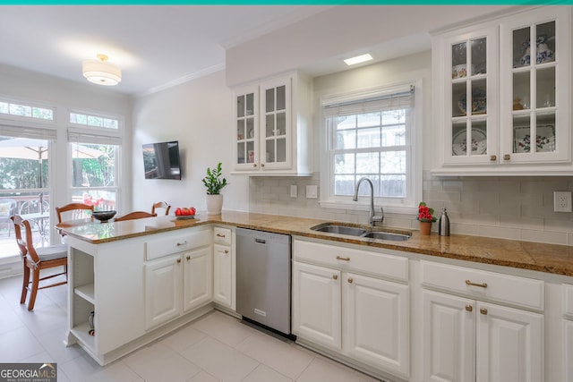kitchen with stainless steel dishwasher, a sink, a peninsula, white cabinets, and crown molding