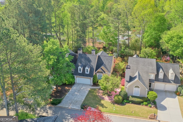 view of subject property featuring a forest