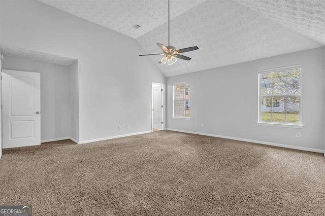 empty room featuring baseboards, carpet flooring, a textured ceiling, visible vents, and ceiling fan