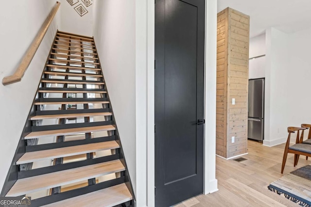 2424 Memorial Dr SE Unit 3, Atlanta, GA 30317 - stairway featuring visible vents, baseboards, and wood finished floors