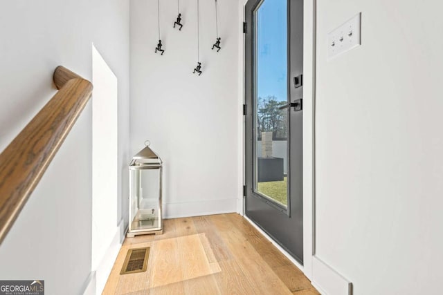 2424 Memorial Dr SE Unit 3, Atlanta, GA 30317 - doorway featuring a wealth of natural light, visible vents, baseboards, and wood finished floors