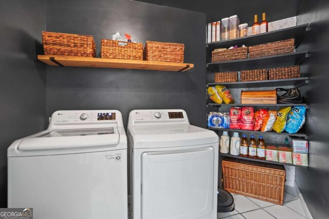 5663 Brookstone Dr NW, Acworth, GA 30101 - laundry area with washer and clothes dryer, tile patterned flooring, and laundry area