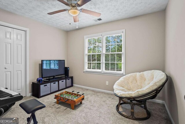 5663 Brookstone Dr NW, Acworth, GA 30101 - living area with visible vents, baseboards, a textured ceiling, and carpet flooring