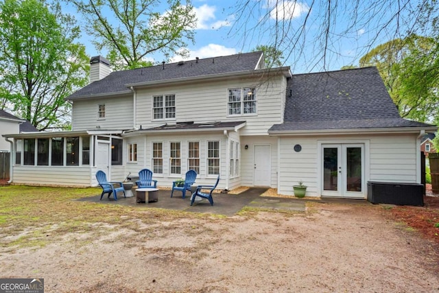 5663 Brookstone Dr NW, Acworth, GA 30101 - rear view of property with french doors, a chimney, a patio area, a sunroom, and an outdoor fire pit