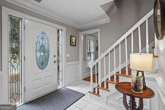 5663 Brookstone Dr NW, Acworth, GA 30101 - foyer featuring wainscoting, visible vents, stairs, a decorative wall, and light tile patterned floors