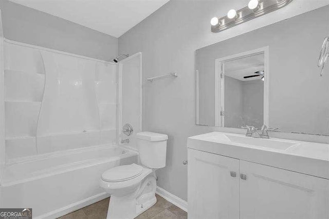 full bathroom featuring toilet, vanity, bathing tub / shower combination, and baseboards