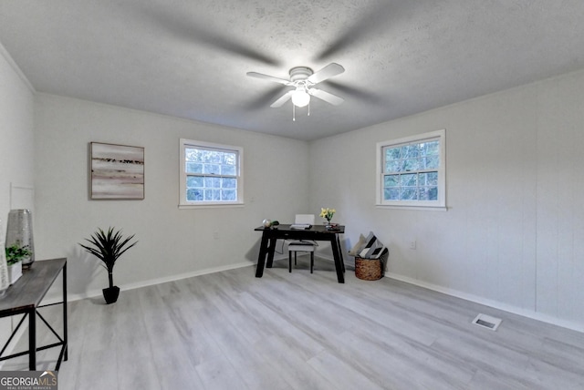 21 W Lake Dr, Oxford, GA 30054 - office with baseboards, a textured ceiling, a ceiling fan, visible vents, and wood finished floors