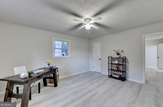21 W Lake Dr, Oxford, GA 30054 - office area with light wood-style flooring, baseboards, and a ceiling fan