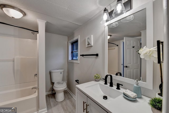 21 W Lake Dr, Oxford, GA 30054 - full bath with shower / bathtub combination, a textured ceiling, vanity, toilet, and wood finished floors
