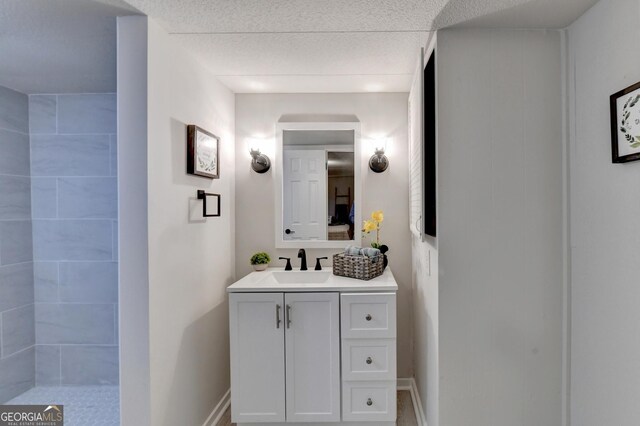 21 W Lake Dr, Oxford, GA 30054 - full bath featuring vanity, baseboards, and a tile shower