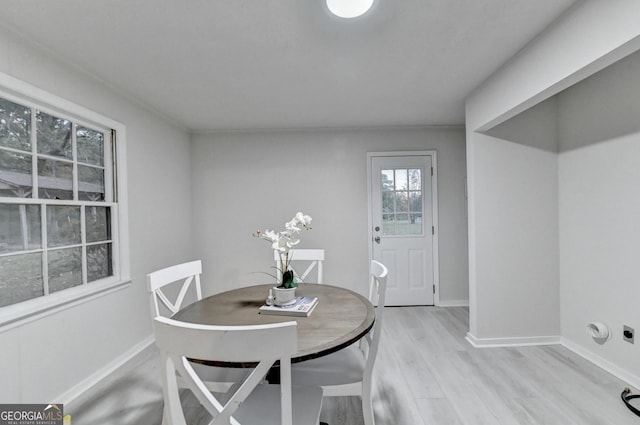21 W Lake Dr, Oxford, GA 30054 - dining space with light wood-style flooring and baseboards