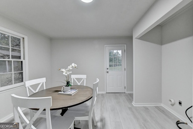 21 W Lake Dr, Oxford, GA 30054 - dining room with light wood finished floors and baseboards