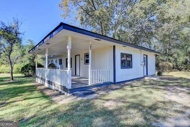 21 W Lake Dr, Oxford, GA 30054 - view of front of property with a front yard and a porch