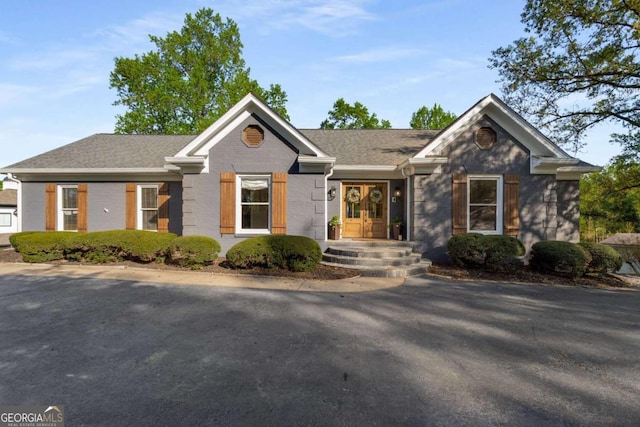 6477 Old Shadburn Ferry Rd, Buford, GA 30518 - ranch-style house with brick siding, french doors, and a shingled roof