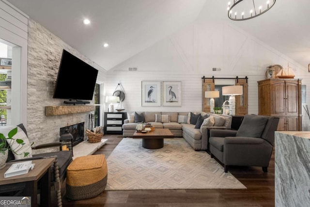 6477 Old Shadburn Ferry Rd, Buford, GA 30518 - living area featuring a fireplace, wood finished floors, a chandelier, recessed lighting, and high vaulted ceiling