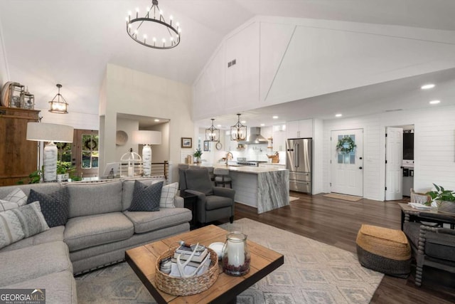 6477 Old Shadburn Ferry Rd, Buford, GA 30518 - living room featuring a chandelier, high vaulted ceiling, dark wood-type flooring, and recessed lighting