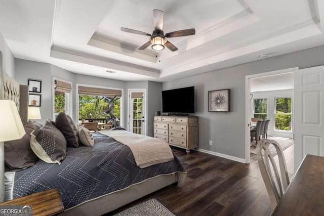 6477 Old Shadburn Ferry Rd, Buford, GA 30518 - bedroom with a raised ceiling, multiple windows, dark wood-style flooring, and access to exterior
