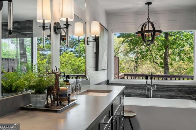 6477 Old Shadburn Ferry Rd, Buford, GA 30518 - bar with a sink, healthy amount of natural light, and a chandelier