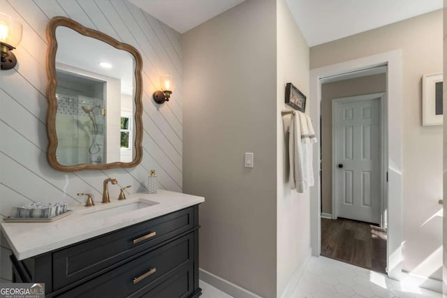 6477 Old Shadburn Ferry Rd, Buford, GA 30518 - full bath featuring a shower, vanity, tile patterned flooring, baseboards, and wood walls