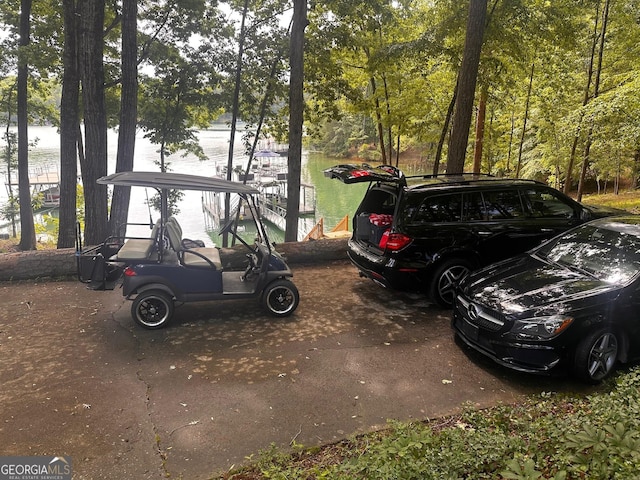 6477 Old Shadburn Ferry Rd, Buford, GA 30518 - view of car parking with a water view