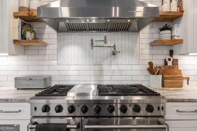 6477 Old Shadburn Ferry Rd, Buford, GA 30518 - kitchen with wall chimney range hood, range with two ovens, open shelves, and decorative backsplash
