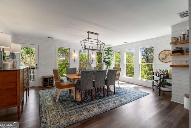 6477 Old Shadburn Ferry Rd, Buford, GA 30518 - dining room with dark wood finished floors and a chandelier