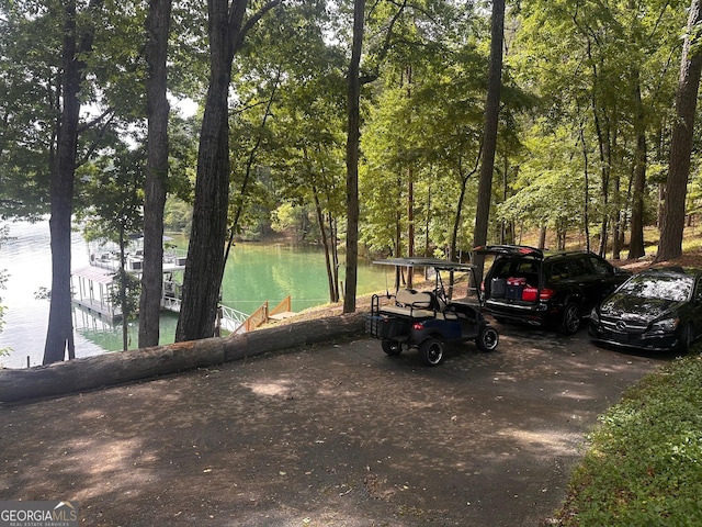 6477 Old Shadburn Ferry Rd, Buford, GA 30518 - view of vehicle parking featuring a boat dock and a water view