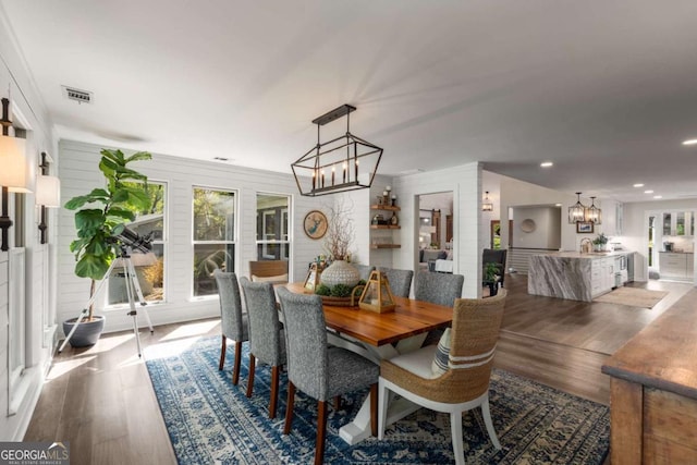 6477 Old Shadburn Ferry Rd, Buford, GA 30518 - dining space featuring a chandelier, dark wood finished floors, healthy amount of natural light, and recessed lighting