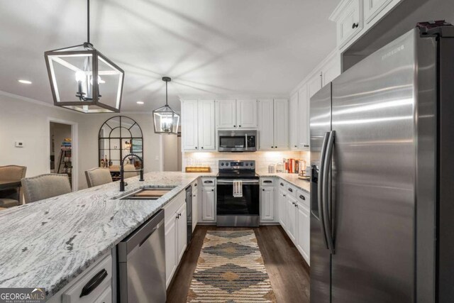 6477 Old Shadburn Ferry Rd, Buford, GA 30518 - kitchen with appliances with stainless steel finishes, a sink, dark wood-type flooring, recessed lighting, and white cabinetry