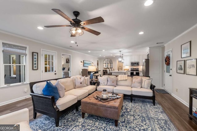 6477 Old Shadburn Ferry Rd, Buford, GA 30518 - living area with recessed lighting, dark wood finished floors, baseboards, ceiling fan, and ornamental molding