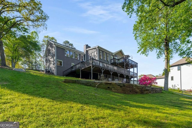 6477 Old Shadburn Ferry Rd, Buford, GA 30518 - rear view of house with a deck, stairway, a yard, and a chimney